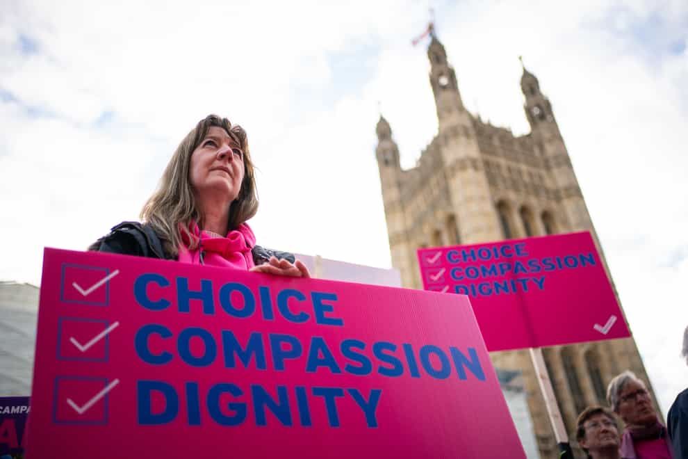Demonstrators during a protest outside the Houses of Parliament (Dominic Lipinski/PA)