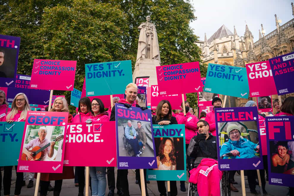 Demonstrators, including Humanists UK’s members and supporters, during a protest outside the Houses of Parliament as peers debate new assisted dying legislation (Dominic Lipinski/PA)