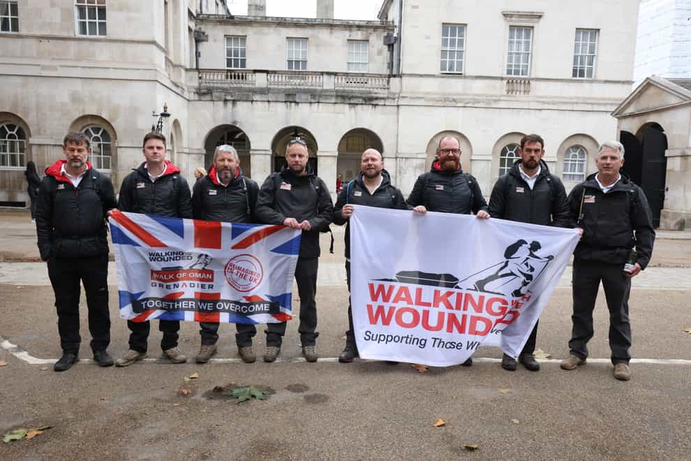 Walkers taking part in the Grenadier Walk of Oman during a break at Horse Guards Parade, Whitehall, central London (PA)