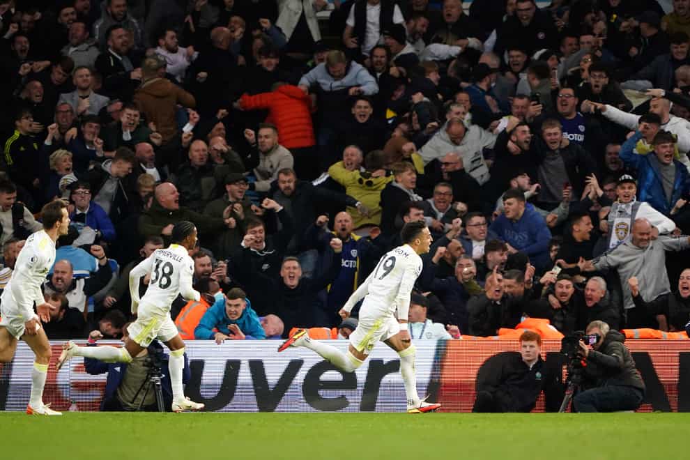 Rodrigo, right, celebrates his equaliser in front of the Leeds fans (Zac Goodwin/PA)