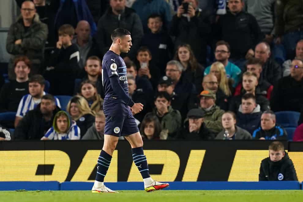 Phil Foden scored twice as Manchester City won at Brighton (Gareth Fuller/PA)