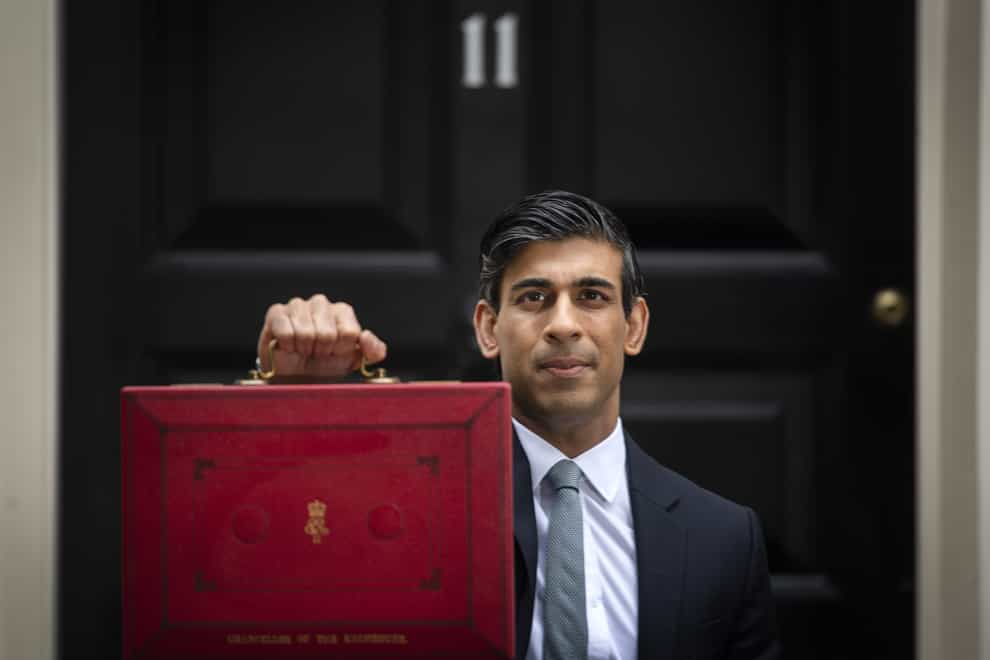 Chancellor of the Exchequer, Rishi Sunak outside 11 Downing Street, London, before heading to the House of Commons to deliver his Budget earlier this year (Victoria Jones/PA)