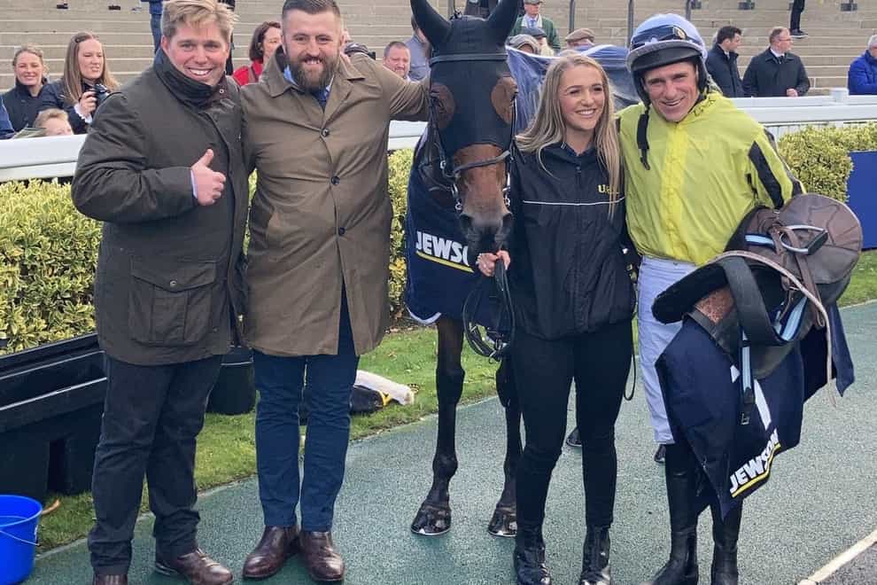 Allmankind and connections after his Aintree win (PA)