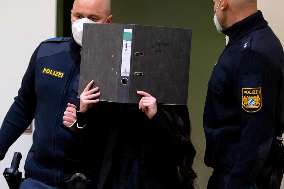 Defendant Jennifer W arrives in a courtroom for her trial in Munich, Germany (Sven Hoppe/dpa via AP)