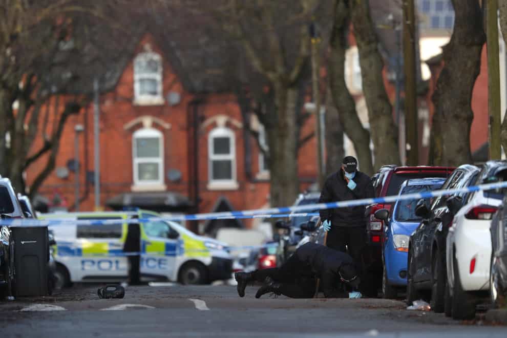 Police officers searching the scene in Linwood Road, Handsworth. (David Davies/PA)