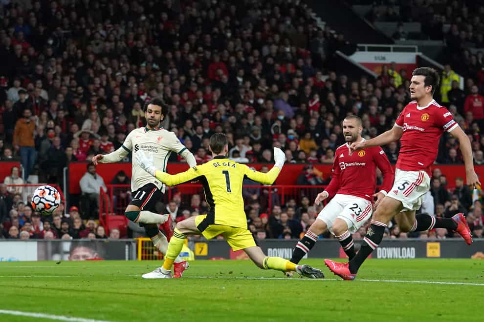 Liverpool’s Mohamed Salah (left) scores their side’s fifth goal of the game, completing his hat-trick during the Premier League match at Old Trafford, Manchester. Picture date: Sunday October 24, 2021.