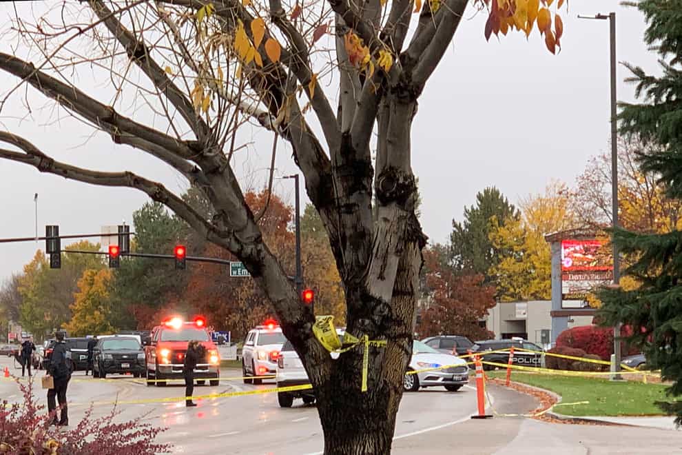 Police close off a street outside a shopping centre after a shooting in Boise, Idaho (Rebecca Boone/AP)
