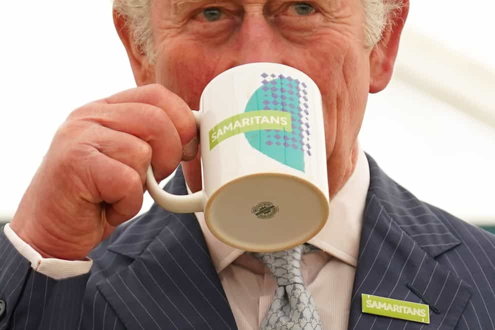 The Prince of Wales had a cuppa when he visited the Samaritans branch in Gloucester (Jacob King/PA)