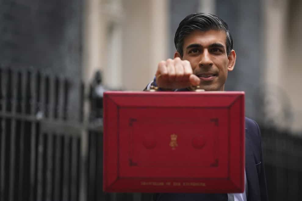 Chancellor Rishi Sunak leaves 11 Downing Street before delivering his Budget to the House of Commons (PA)