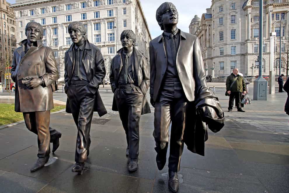 A new statue of the Beatles outside the Liverbuilding (Peter Byrne/PA)