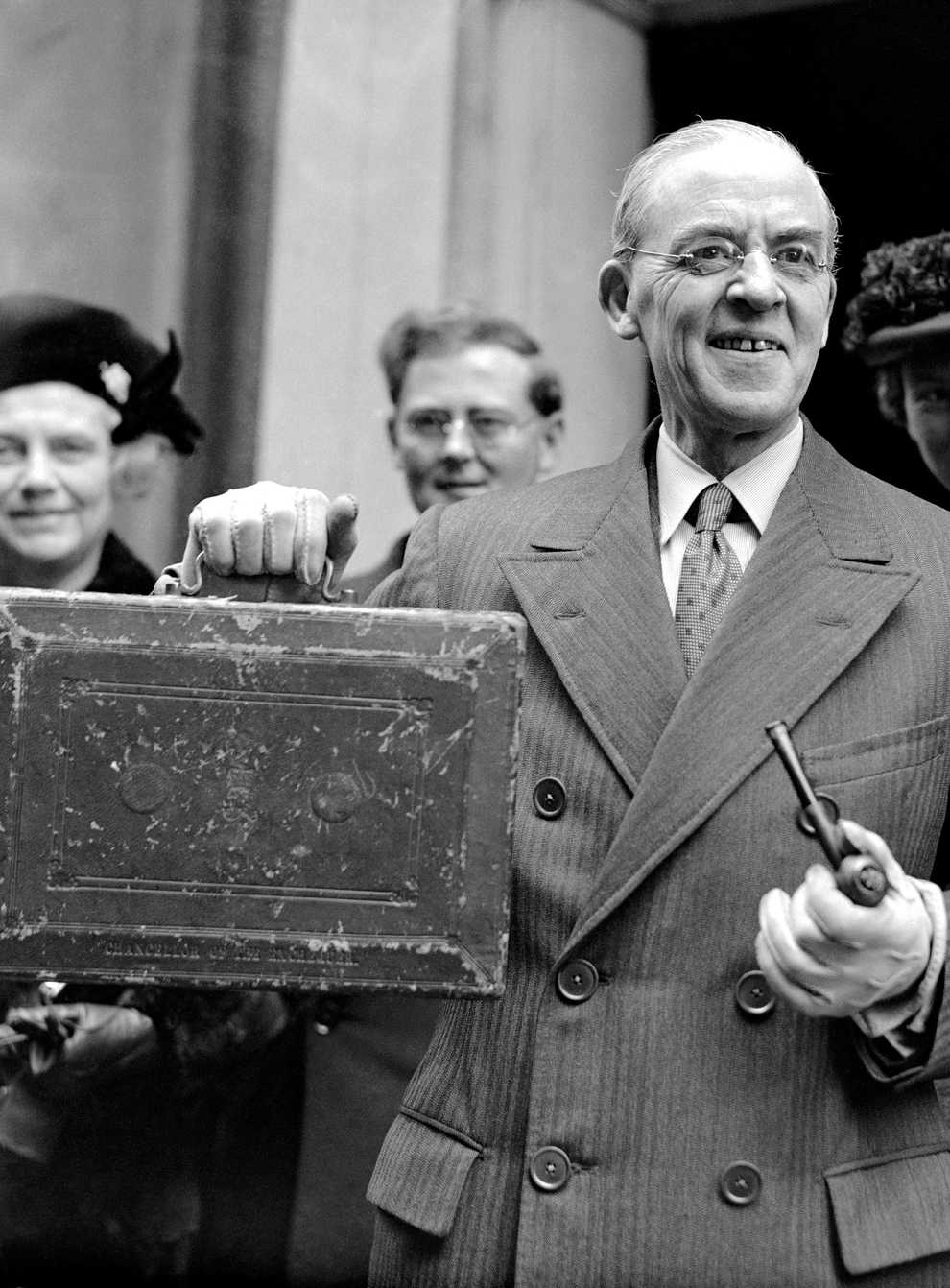 Sir Stafford Cripps, Labour chancellor of the exchequer, pictured leaving Downing Street for the House of Commons to present his Budget (PA)