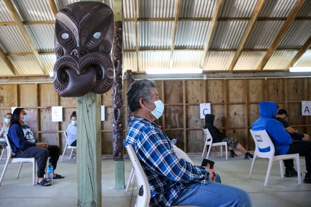 New Zealanders wait to be vaccinated at Manurewe Marae vaccination centre in Auckland, New Zealand (Sylvie Whinray/New Zealand Herald via AP)