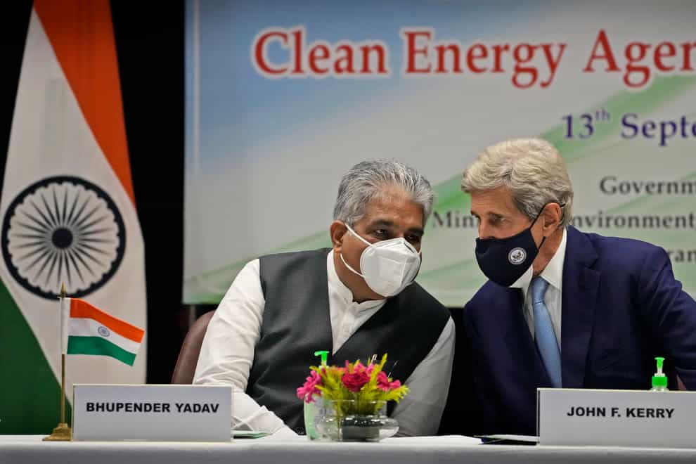 Indian environment minister Bhupender Yadav, left and US special presidential envoy for climate John Kerry talk during the launch of Climate Action and Finance Mobilisation Dialogue under India-US Agenda 2030 Partnership in New Delhi, India (Manish Swarup/AP)