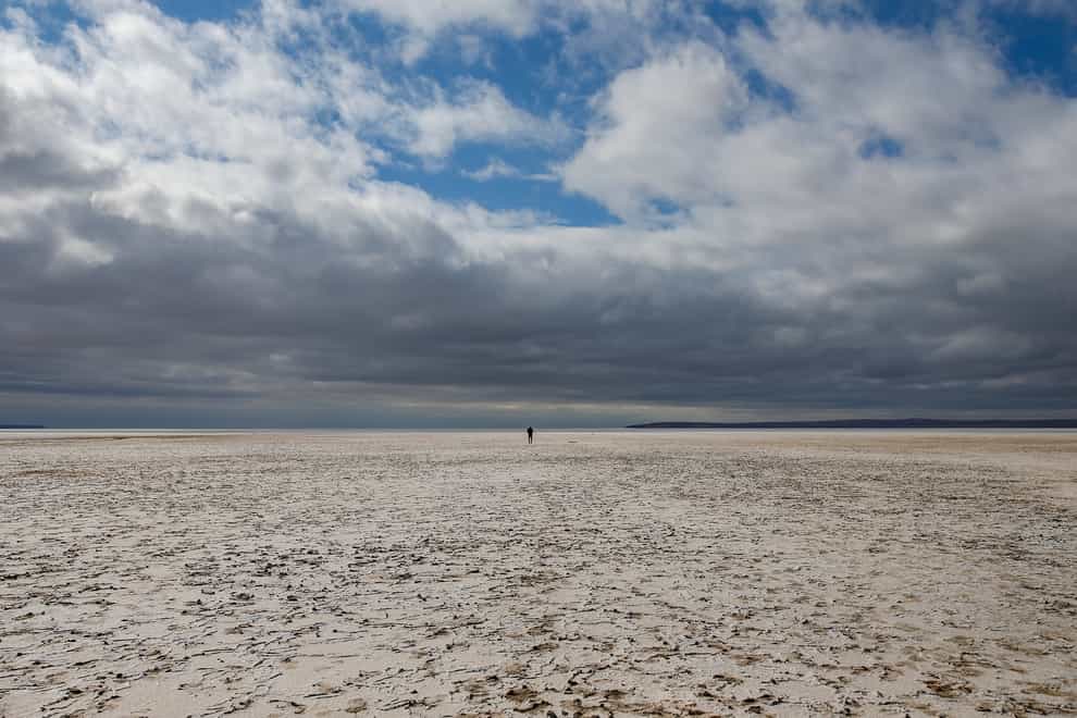 A man walks along Lake Tuz in Aksaray province, Turkey (Emrah Gurel/AP)