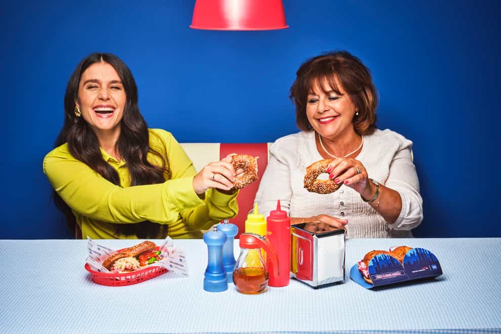 Jessie and Lennie Ware enjoy Twist & Share Bagels, designed to celebrate the British Airways American Express® Cards Companion Voucher benefit which could entitle you to a second seat for a companion when you make a Reward Flight booking (Handout/PA)
