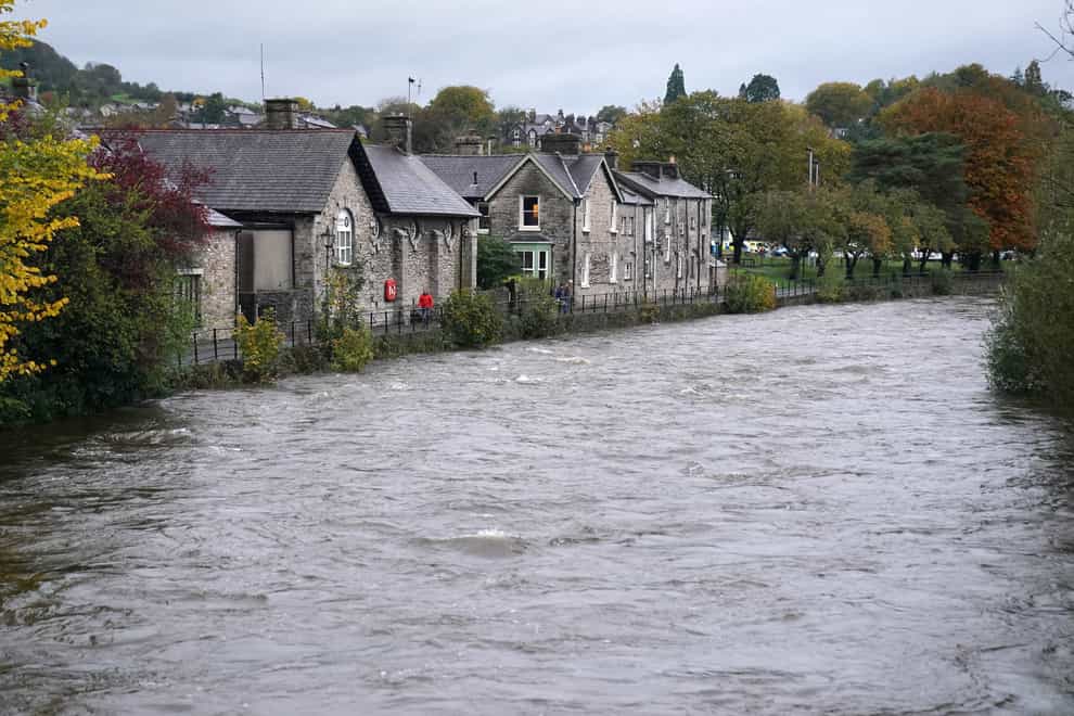 High water levels on the River Kent in Kendal, Cumbria, where the Met office has warned of life-threatening flooding and issued amber weather warnings as the area was lashed with “persistent and heavy rain”. Up to 300mm is expected to fall in parts of the region, which typically sees an average of 160mm in October. Picture date: Thursday October 28, 2021.