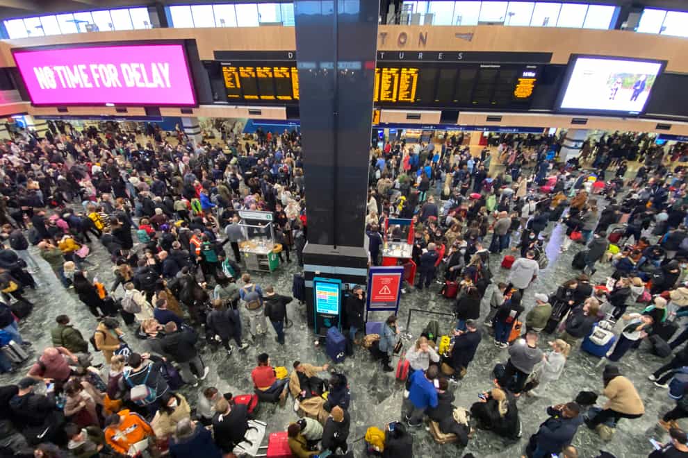 Hundreds of passengers hoping to travel to Glasgow for the Cop26 climate summit by train have been left waiting inside London’s Euston station (Yui Mok/PA)