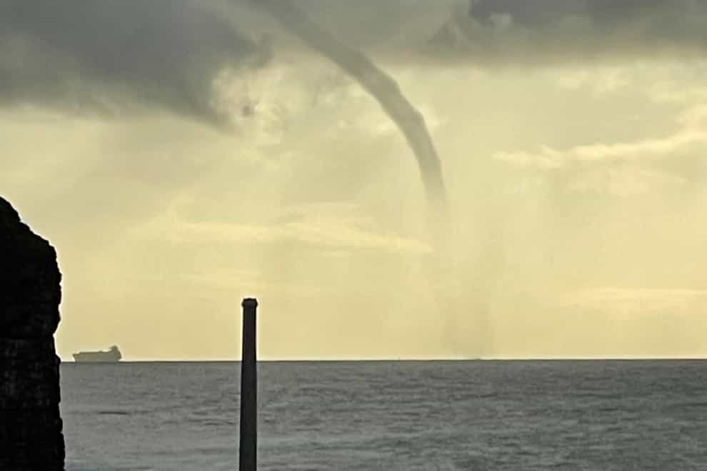 Waterspouts are formed when a rotating column of wind draws in cloud droplets (James Thomas/thefamilyrhino.com)