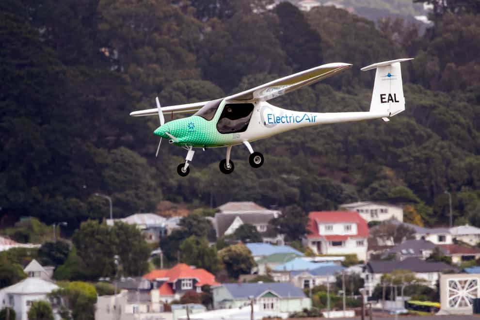 The ElectricAir plane is on approach before landing at Wellington Airport in Wellington, New Zealand, Monday, Nov. 1, 2021. Seeking to highlight the potential for green aviation as a pivotal climate change conference opened in Glasgow, New Zealand pilot Gary Freedman made the first-ever flight over Cook Strait in an electric plane. (Mark Mitchell/New Zealand Herald via AP)