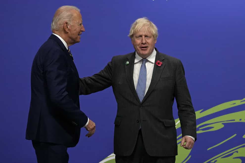 Boris Johnson greets US President Joe Biden (Alastair Grant/PA)