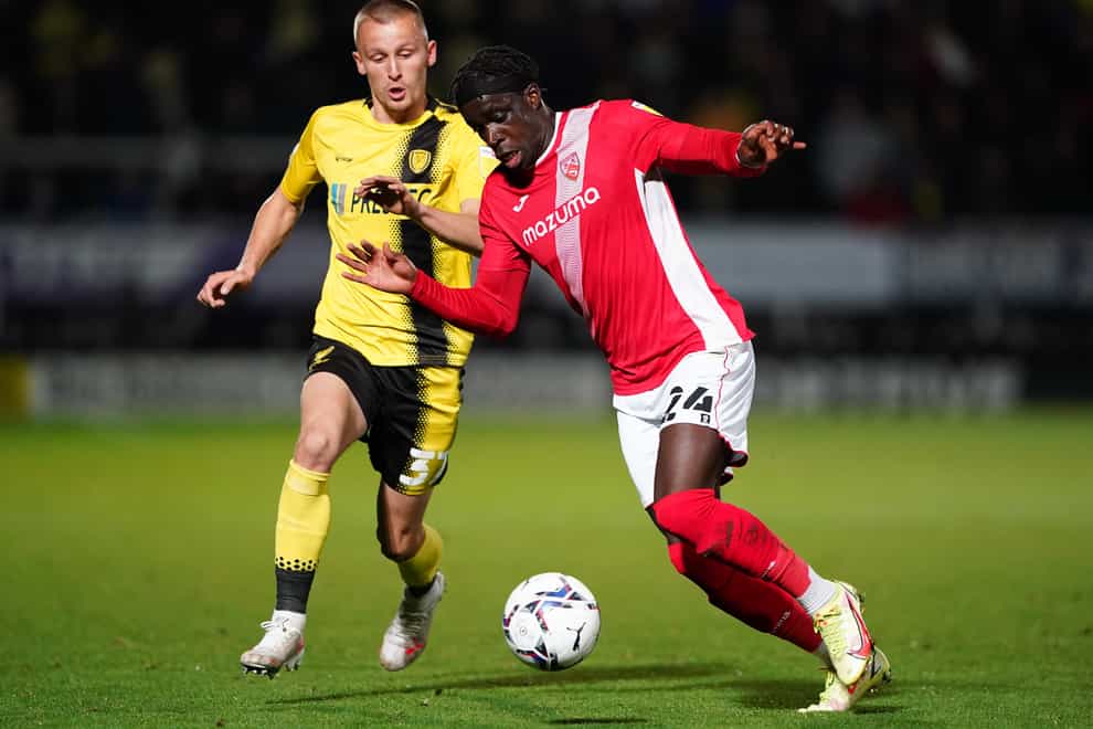 Morecambe’s Arthur Gnahoua, right, is a doubt for Tuesday night’s League One clash with Cambridge (Zac Goodwin/PA)