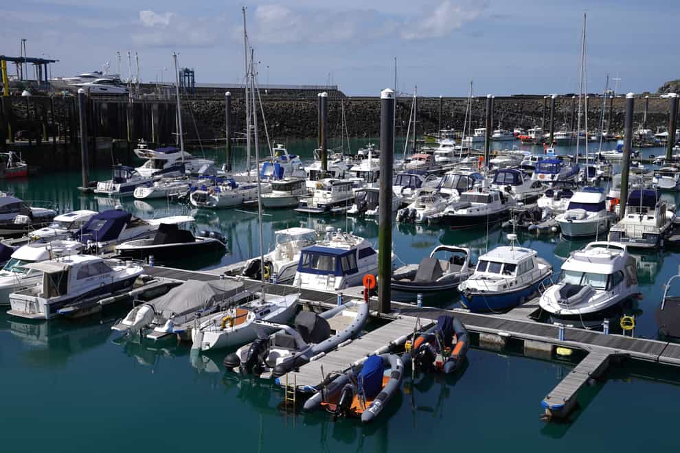 Boats in the harbour at St Helier (PA)