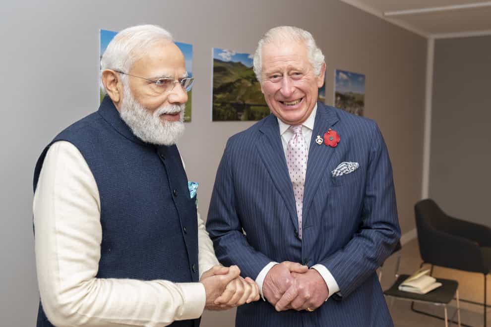 Narendra Modi speaks with the Prince of Wales at the Cop26 summit (Jane Barlow/PA)