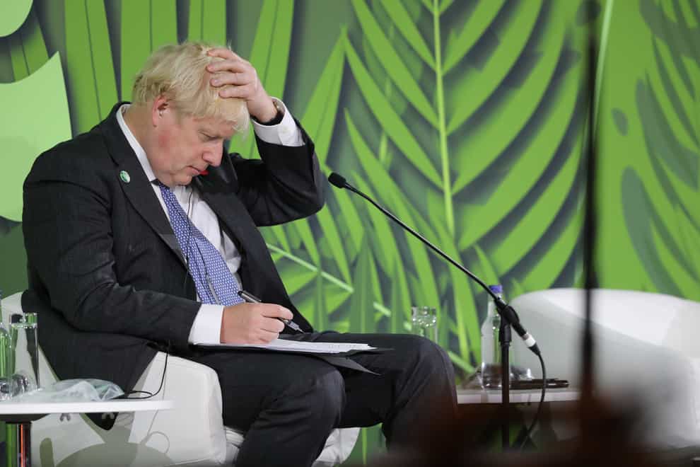 Boris Johnson has hailed a pledge by more than 100 international leaders at Cop26 to end the ‘great chainsaw massacre’ of the world’s forests (Steve Reigate/Daily Express/PA)