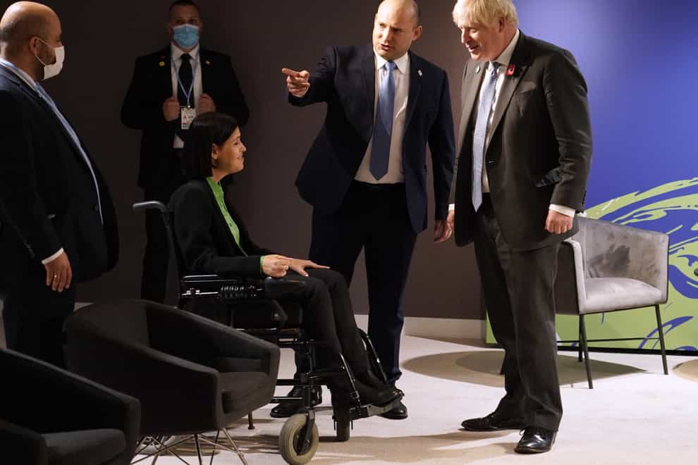 Boris Johnson (right) is introduced to Karine Elharrar (second left) (Alberto Pezzali/PA)