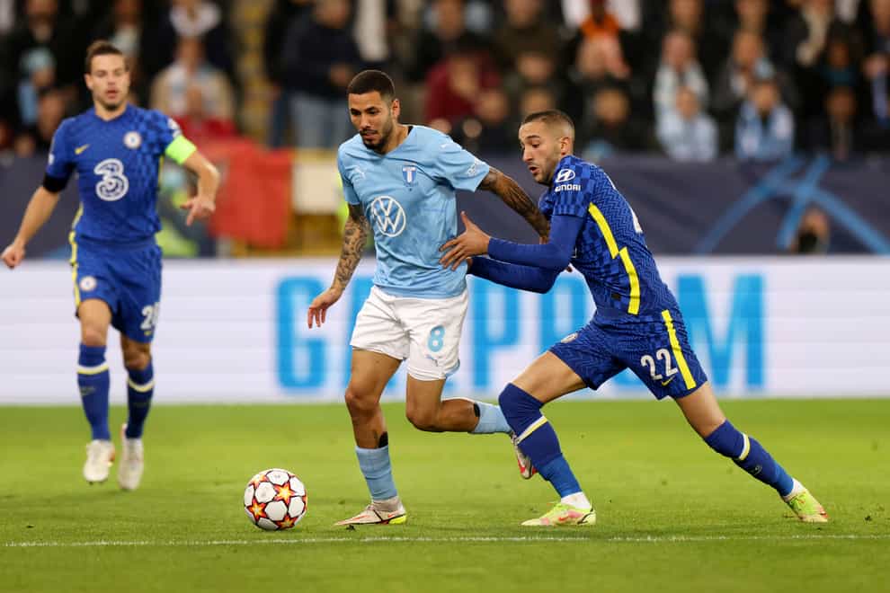 Hakim Ziyech, right, looks to win the ball back for Chelsea against Malmo (Andreas Hillergren/AP/PA)