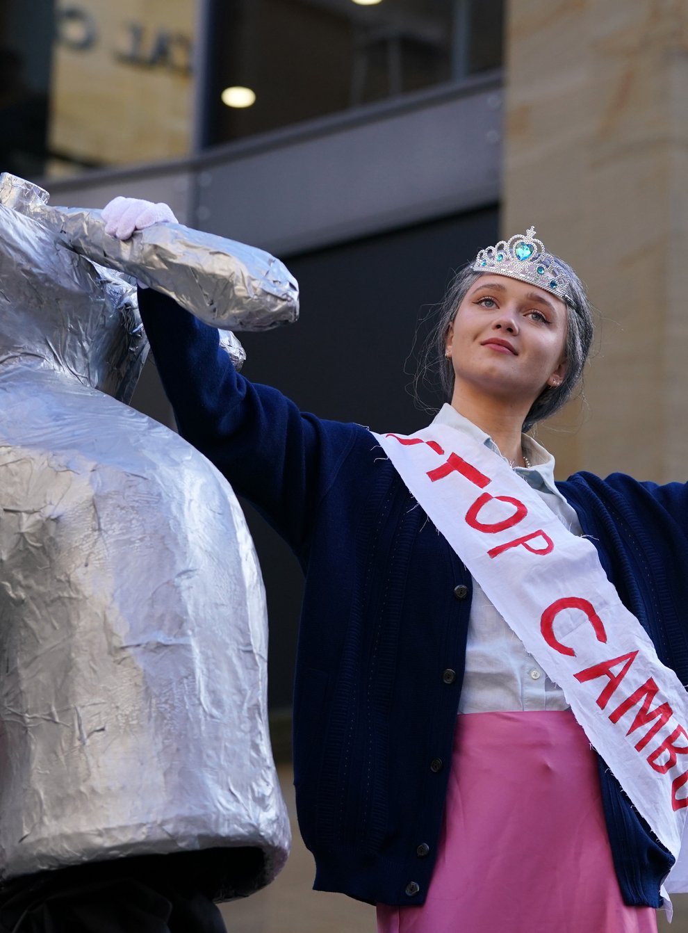 Climate activists stage a mock ceremony on Buchanan Street, Glasgow, featuring ‘the Queen’ (Andrew Milligan/PA)