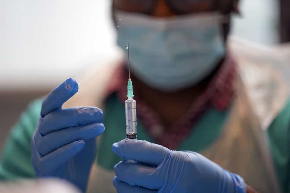 A pharmacist prepares a Covid-19 vaccine at a clinic at Oxford Brookes University (Steve Parsons/PA)