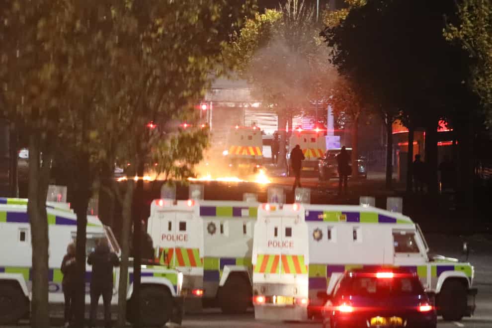 Missiles and fireworks being thrown at police on Lanark Way in the loyalist Shankill Road area close to the peace wall (Brian Lawless/PA)