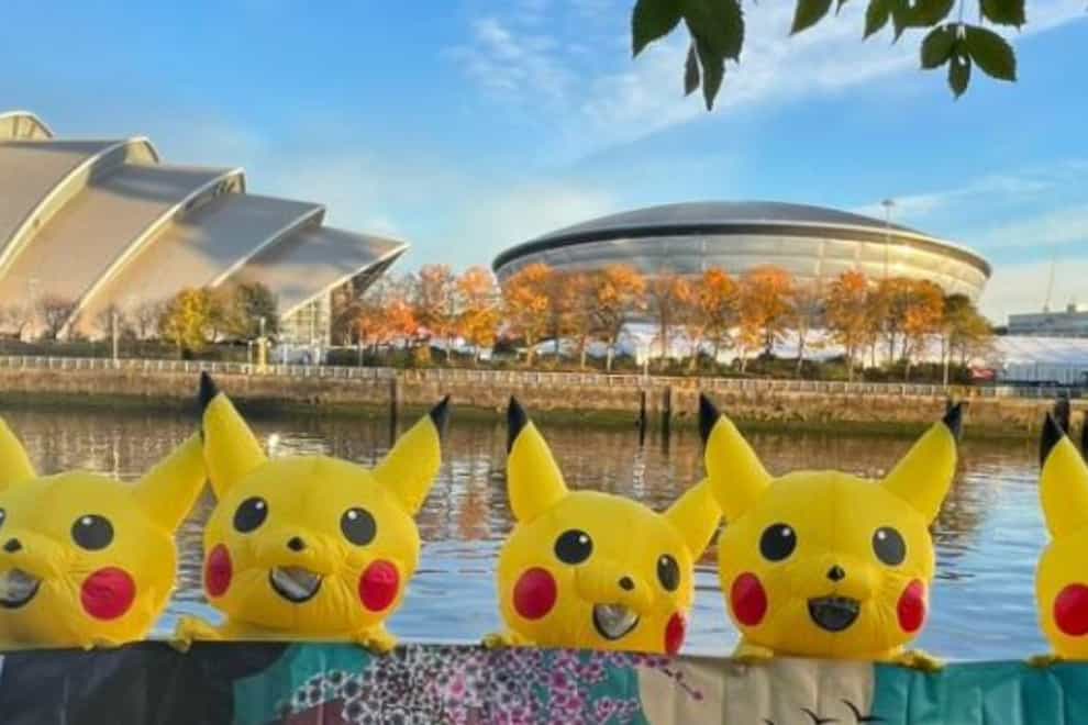 Protesters dressed as Pikachu at Cop26 (No Coal Japan/PA)