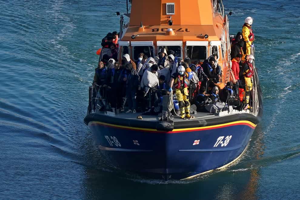 A group of people thought to be migrants are brought in to Dover, Kent, onboard the Dover lifeboat following a small boat incident in the Channel on Tuesday, November 2 (Gareth Fuller/PA)