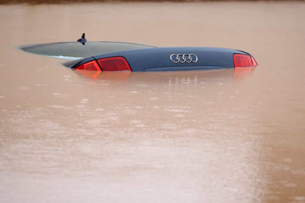 A car is submerged in a flooded street in the Sarajevo suburb of Ilidza, Bosnia (AP)