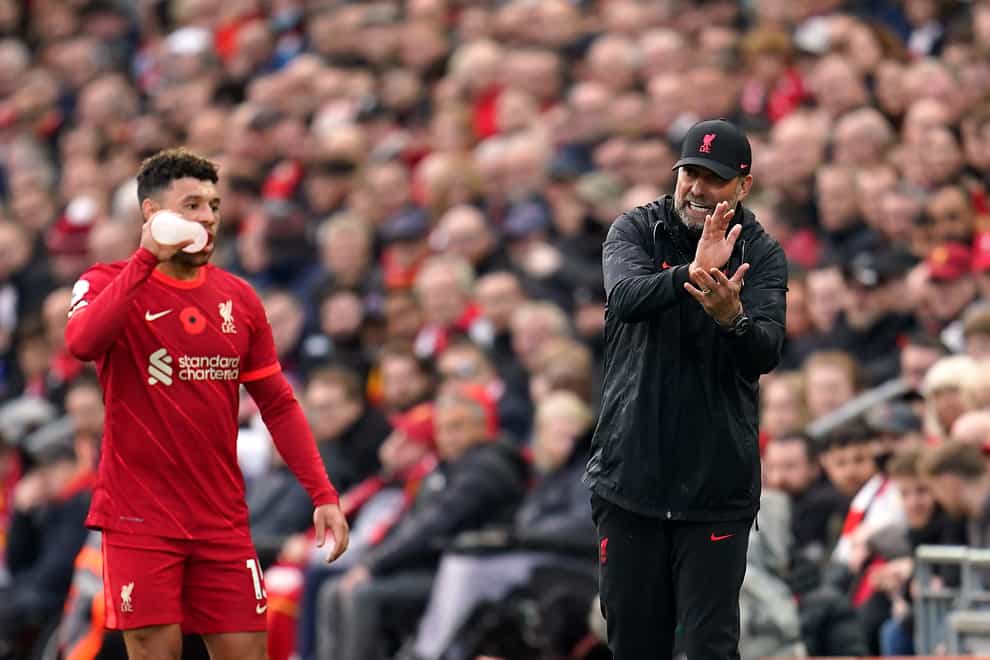 Liverpool manager Jurgen Klopp (right) is happy to embrace both sides to Alex Oxlade-Chamberlain’s (left) game (Nick Potts/PA)