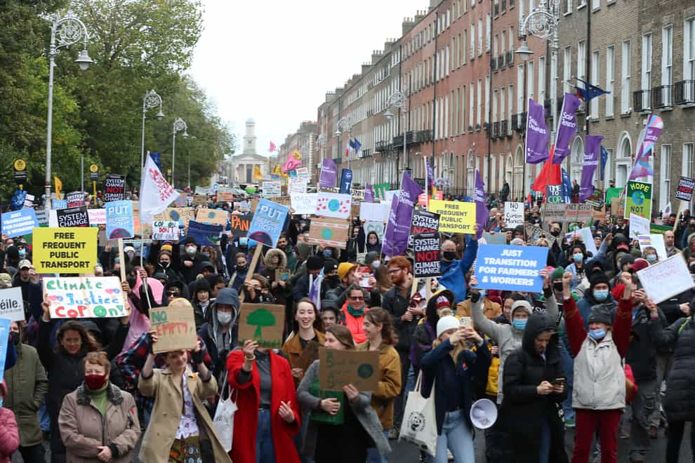 People take part in a climate change protest in Dublin (PA)