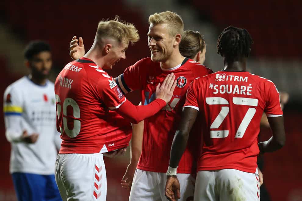 Jayden Stockley (centre) celebrates Charlton’s third goal with his team-mates (Steven Paston/PA)