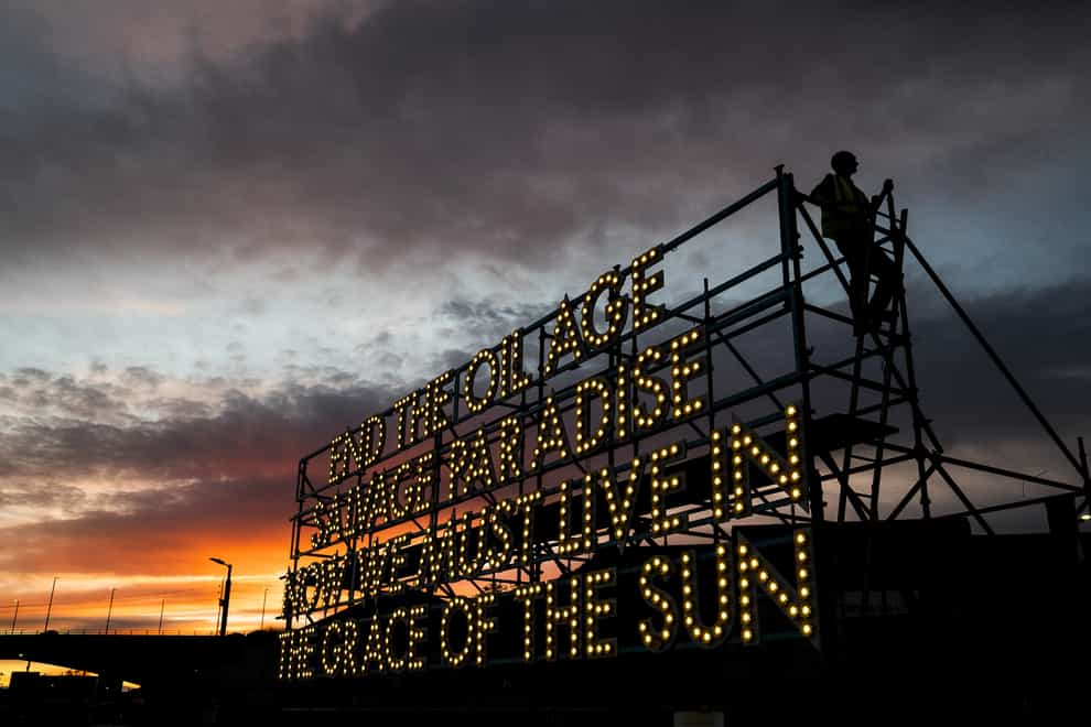 Sunset behind the ‘Grace of the Sun’ a giant solar powered light poem at the Sustainable Glasgow Landing Hub alongside the Glasgow Cop26 campus (Jane Barlow/PA)