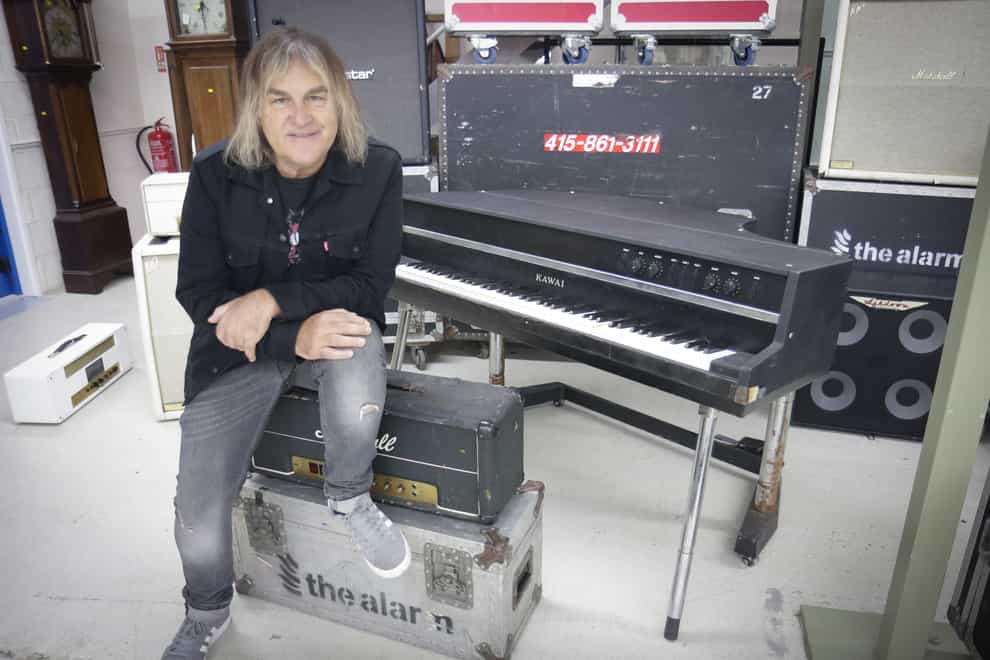 Mike Peters of The Alarm with the Kawai piano which used to belong to rock band Queen (Gardiner Houlgate/PA)
