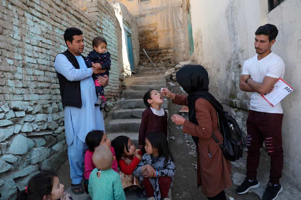 A child is given a polio vaccination in Kabul, Afghanistan (Rahmat Gul/AP)