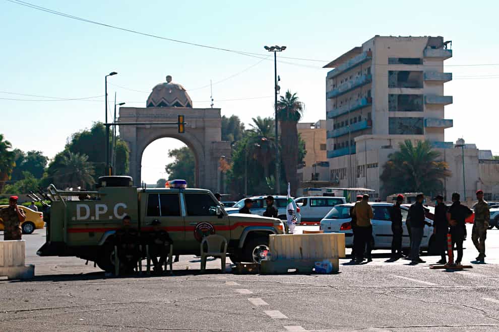 Iraqi Security forces close the heavily fortified Green Zone as they tightened security measures hours after the assassination attempt on the Prime Minister in Baghdad, Iraq, Sunday, Nov. 7, 2021. Prime Minister Mustafa al-Kadhimi survived an assassination attempt with armed drones that targeted his residence early Sunday and officials said he escaped unharmed. (Hadi Mizban/AP)