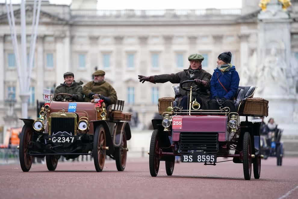 Participants in the RM Sotheby’s London to Brighton Veteran Car Run drive along The Mall (Kirsty O’Connor/PA)