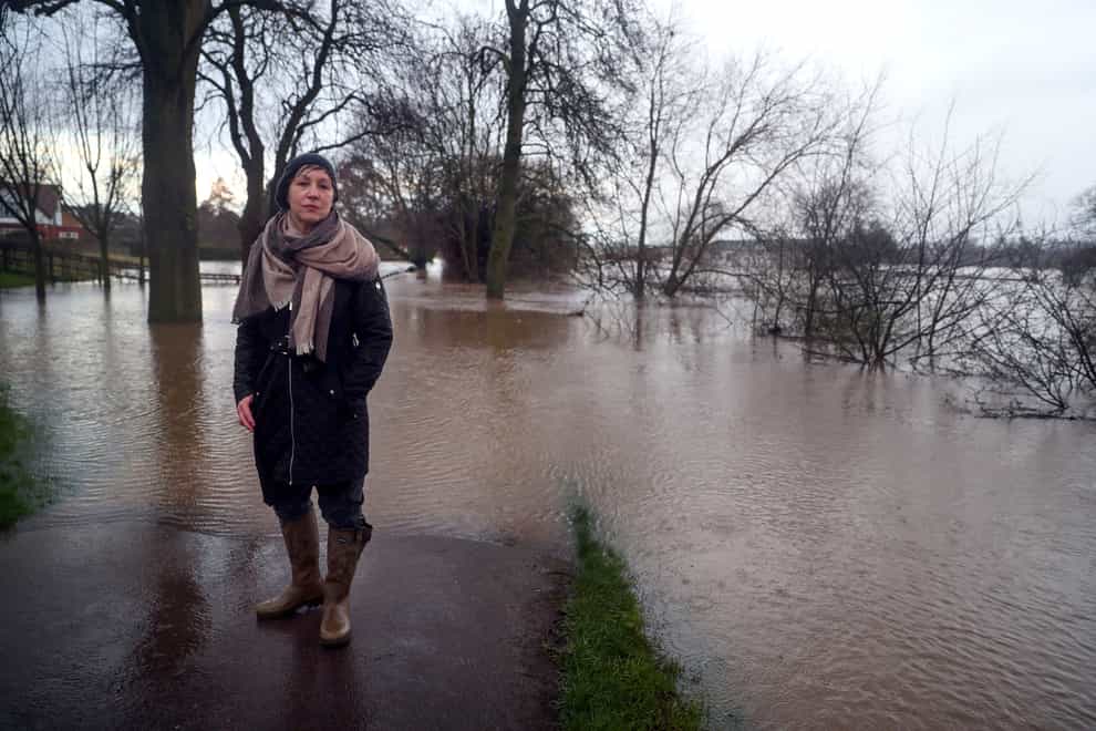 Environment Minister Rebecca Pow at the swollen river in Worcester (Steve Parsons/PA)
