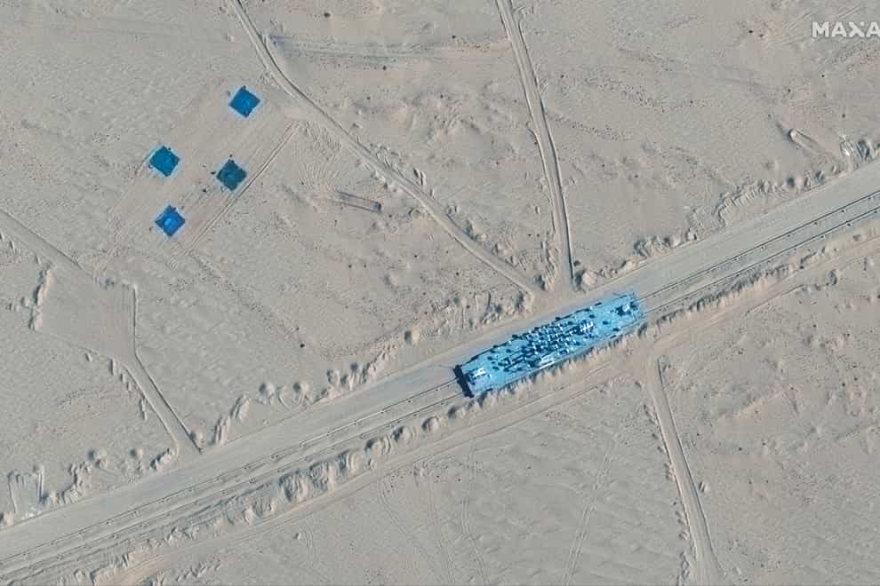 Satellite images appear to show China has built mock-ups of US Navy aircraft carriers and destroyers in its north-western desert (Maxar Technologies via AP)