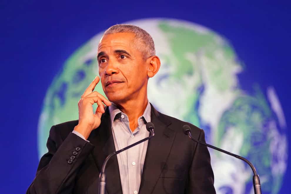 Former US president Barack Obama gives a speech during the Cop26 summit (Jane Barlow/PA)
