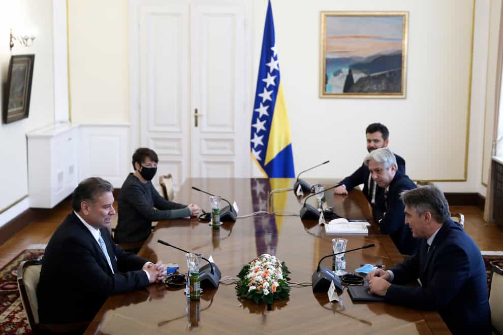 US Deputy Assistant Secretary of State Gabriel Escobar, left, speaks with Croat member of the tripartite Presidency of Bosnia Zeljko Komsic, right, in the capital Sarajevo, Bosnia (AP)