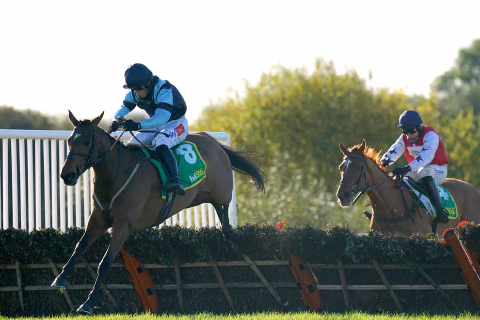 Indefatigable ridden by jockey Daryl Jacob (left) clears a hurdle on their way to winning the bet365 Hurdle at Wetherby racecourse (Tim Goode/PA)