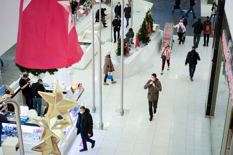 People visit a shopping centre in Moscow, Russia (Pavel Golovkin/AP)